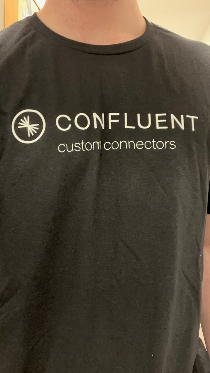 A black t-shirt with the Confluent logo and the words 'custom connectors' underneath it.