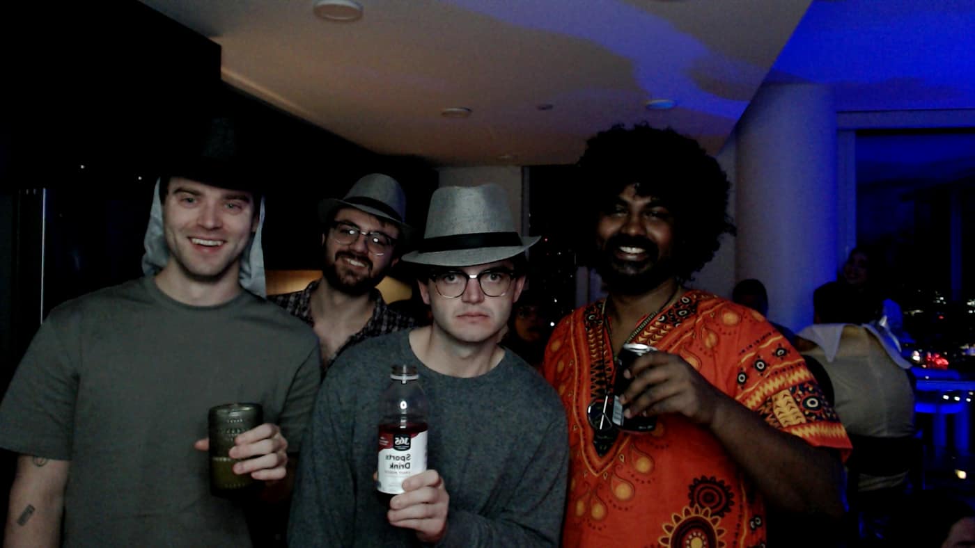 Guests posing at the photo booth during our 2023 Halloween party.
