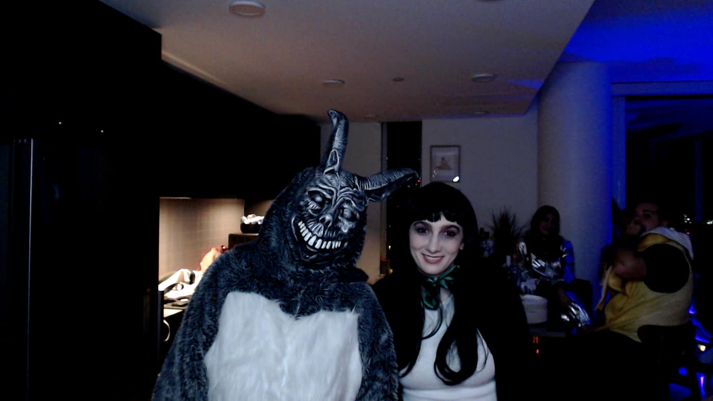Guests posing at the photo booth during our 2023 Halloween party.