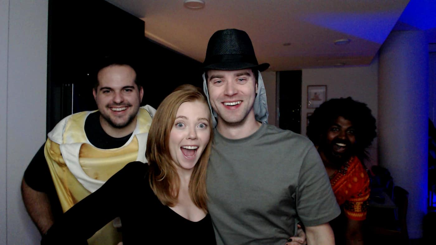 Guests posing at the photo booth during our 2023 Halloween party.