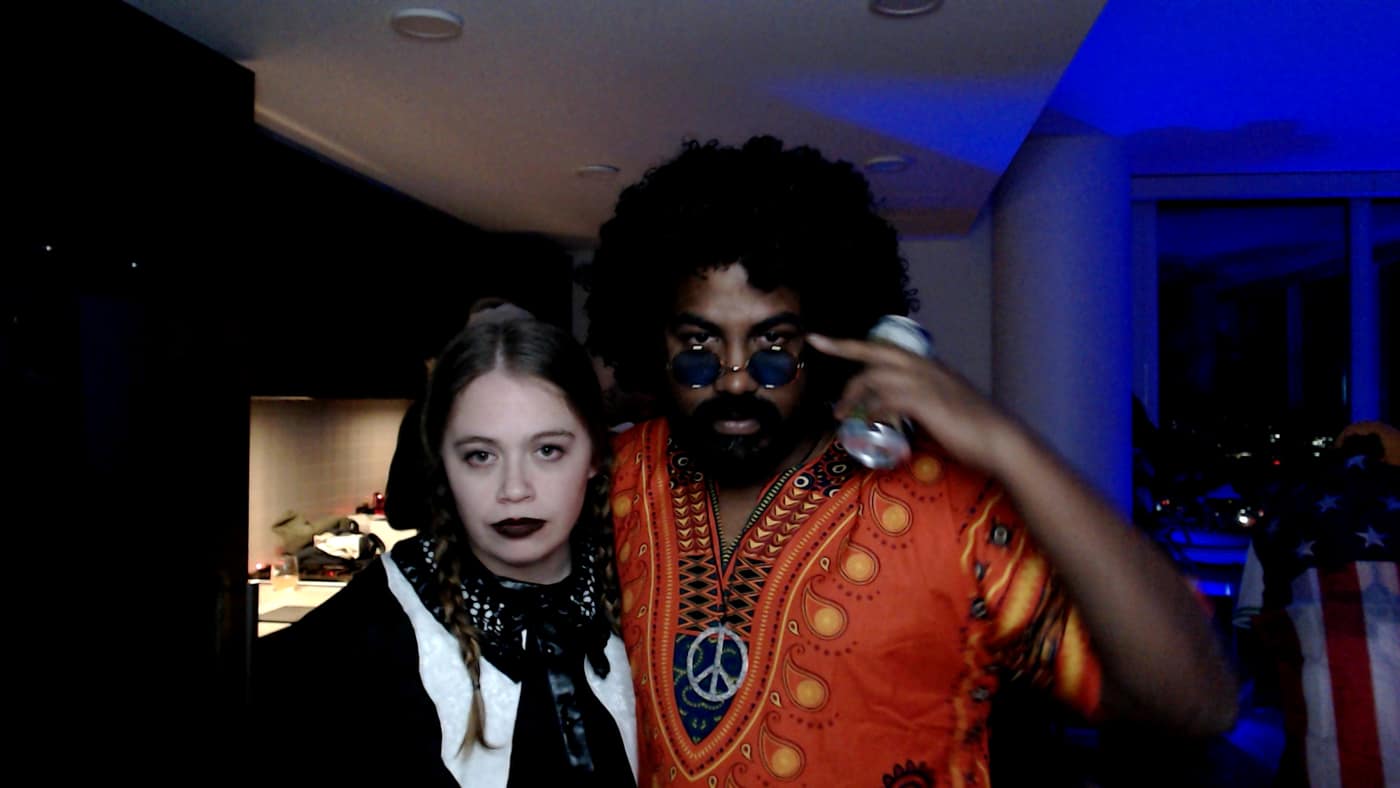 Guests posing at the photo booth during our 2023 Halloween party.