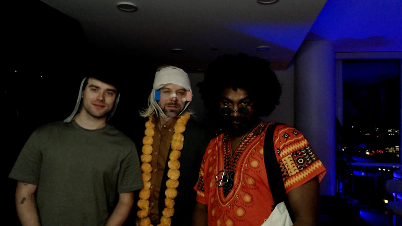 Guests posing at the photo booth during our 2023 Halloween party.
